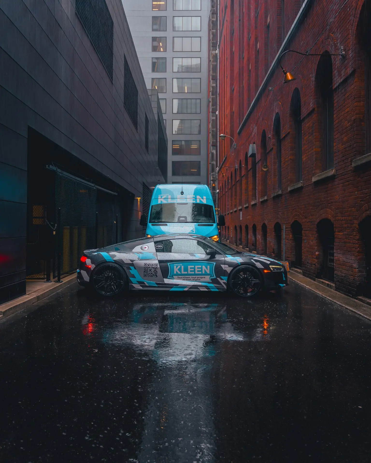KLEEN car and van in a brick alley in the rain
