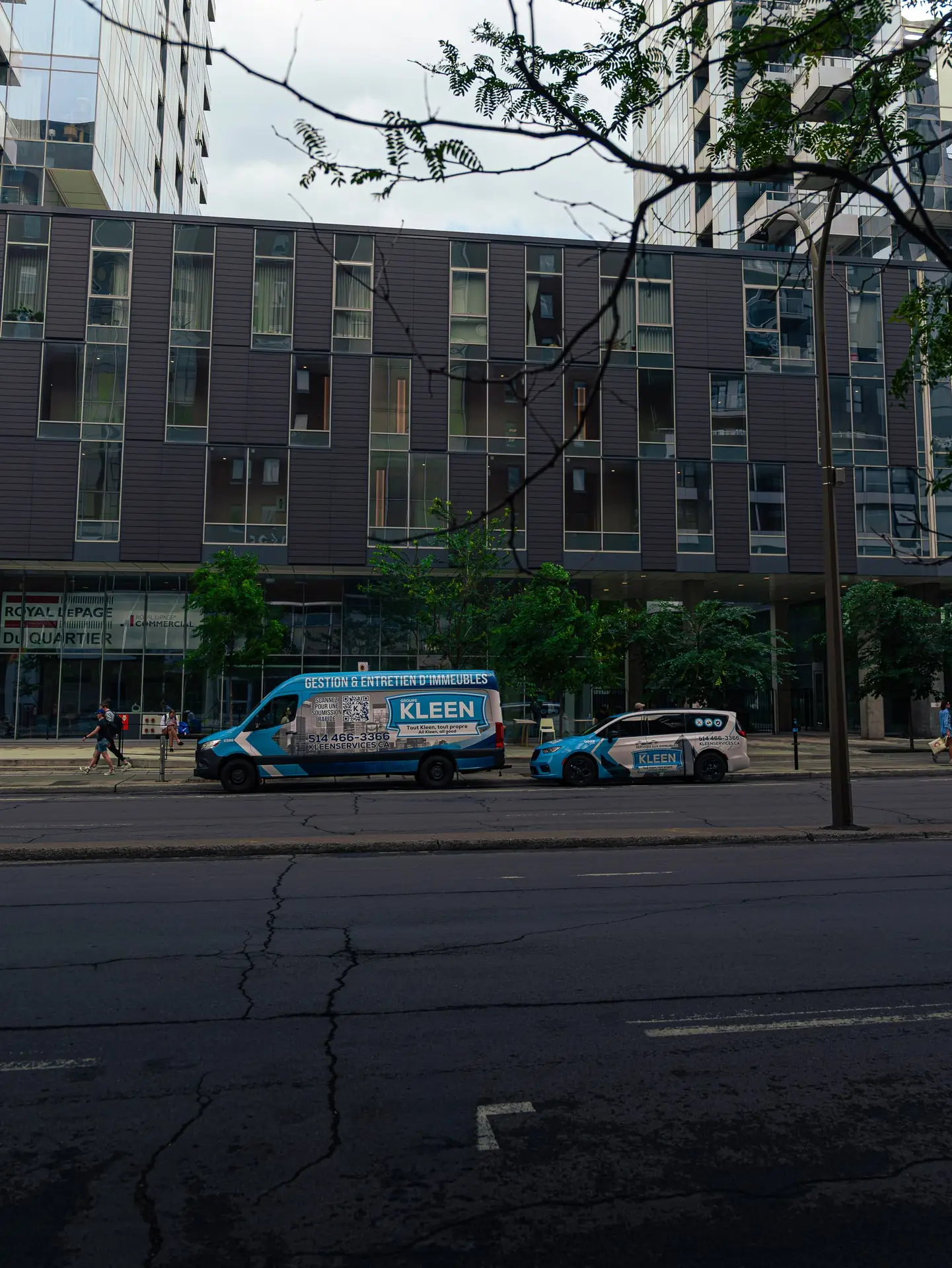 KLEEN van and minivan viewed from across the street