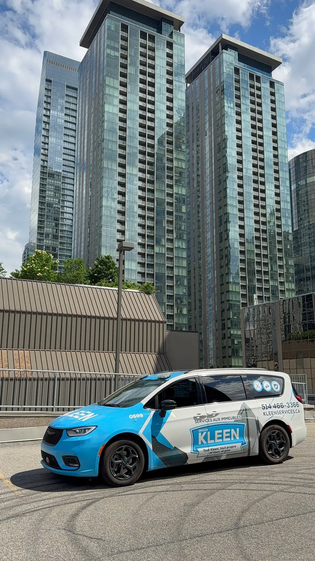 KLEEN vehicle in a neighbourhood of residential towers